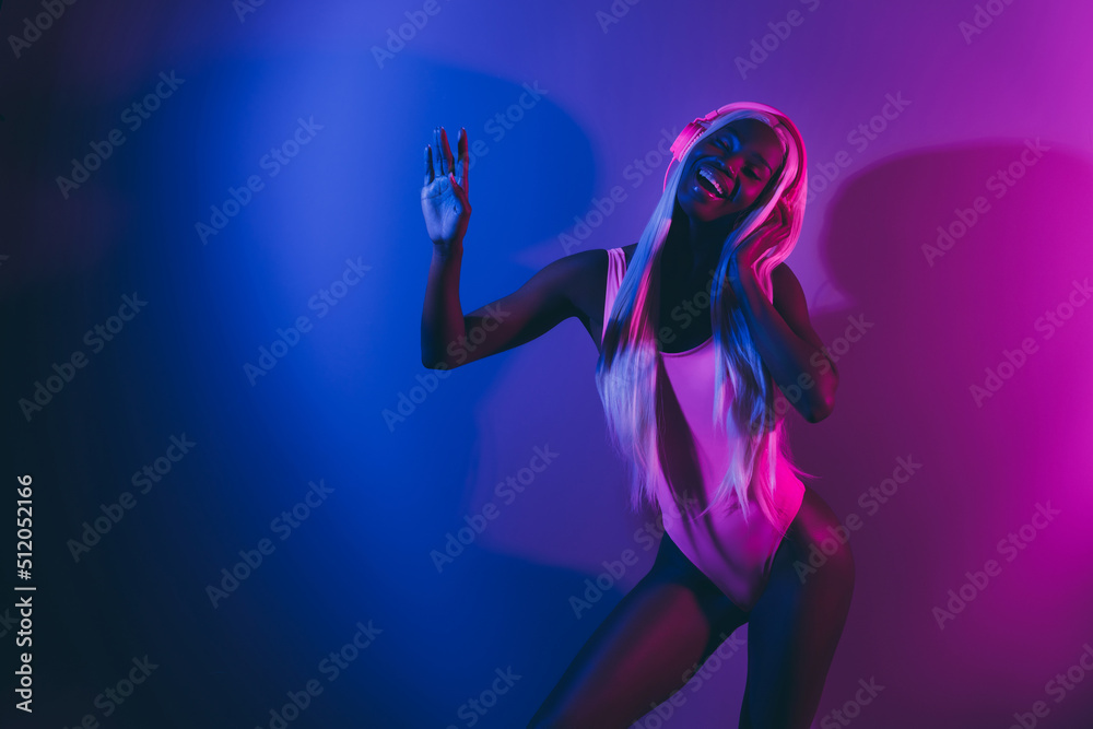 Photo of stunning lady hang out at party occasion listen wireless headset isolated on violet vivid background