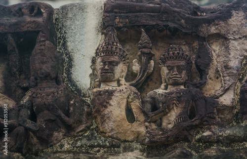 High relief sandstone carvings around the walls of Angkor Wat in Siem Reap, Cambodia.