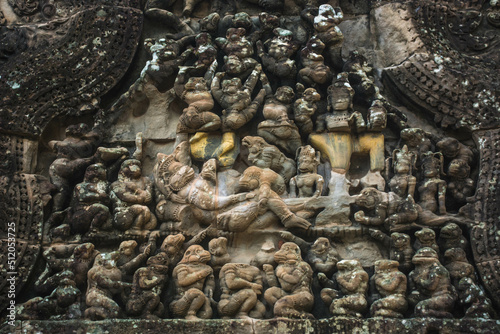 High relief sandstone carvings depicting monkeys in the story of the Ramayana at Angkor Wat Siem Reap Temple, Cambodia