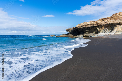 Waves crashing on cliffs at Ajuy volcanic beach, Fuerteventura, Canary Islands, Atlantic photo