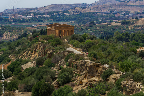 Ancient Greek temple of Concordia, panoramic day view in the Valle dei Templi, Agrigento, UNESCO World Heritage Site, Sicily, Italy photo