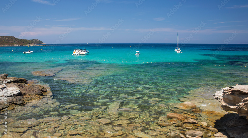 View across clear turquoise water from rocky coastline near the Plage du Loto, St-Florent, Haute-Corse View across clear turquoise water from rocky coastline near the Plage du Loto, St-Florent, Haute-Corse