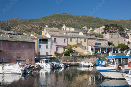View across the tranquil harbour to typical slate-roofed houses, Centuri-Port (Port de Centuri), Haute-Corse