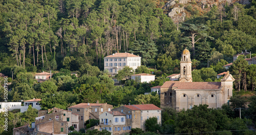 Panoramic view to the village in its woodland setting, evening, Feliceto, L'Ile-Rousse Balagne, Haute-Corse photo