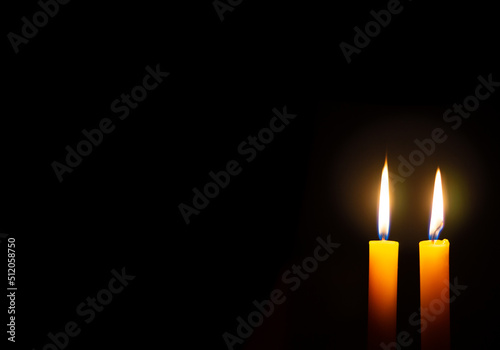Candle in the dark black background