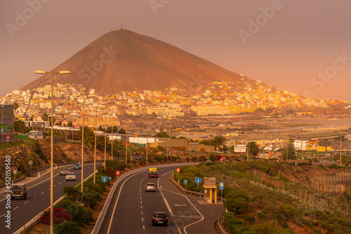 View of colourful houses and mountain backdrop at sunset in Galdar, Las Palmas, Gran Canaria, Canary Islands, Atlantic photo