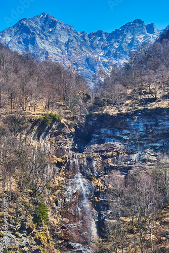 Cascata di Val Mott waterfall and Cima di Bri mount, Valle Verzasca, Switzerland photo