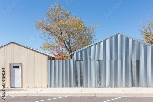 Wallpaper Mural A tree in leaf by low buildings in a small town. Torontodigital.ca