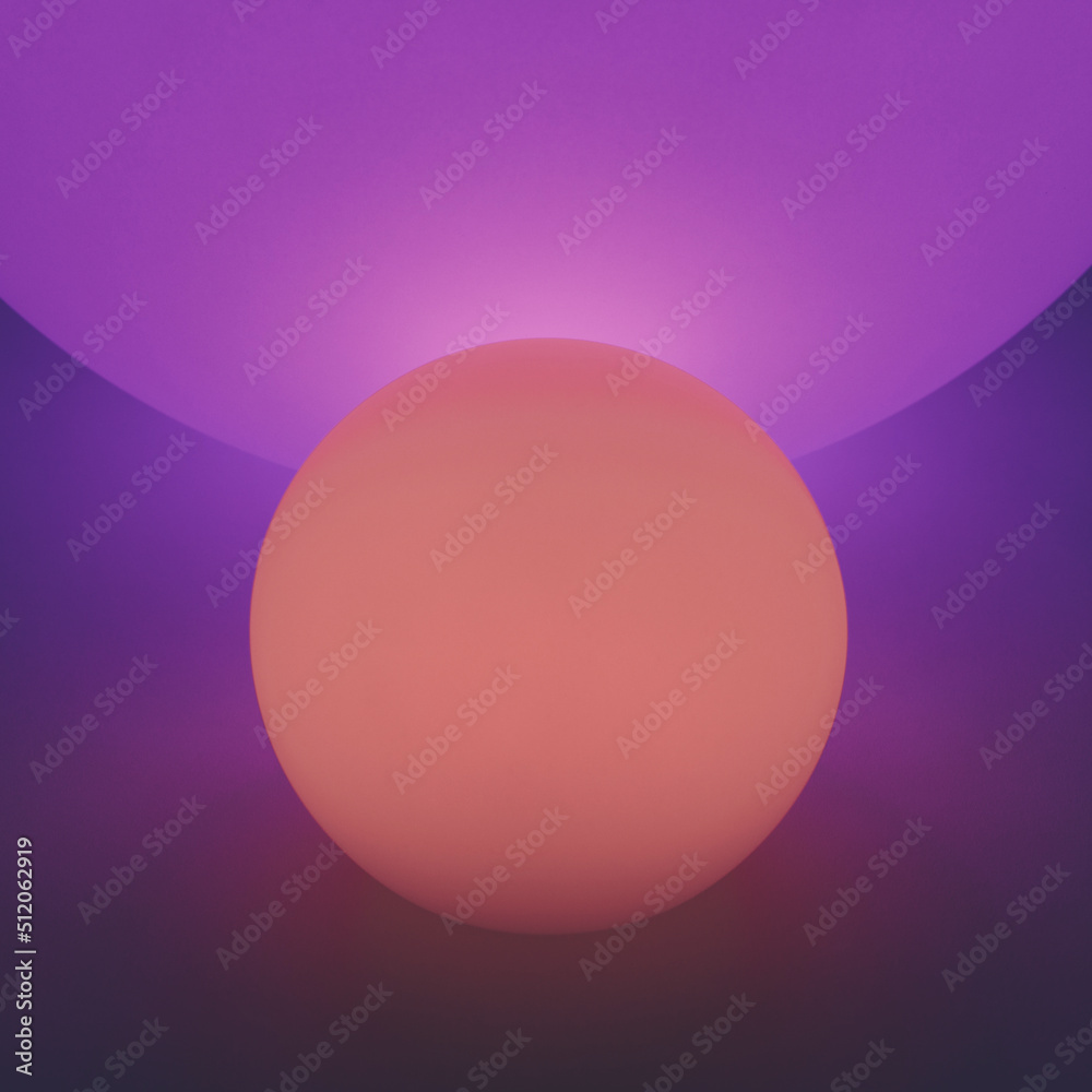 Glowing and illuminated spherical coloured orbs on a black background. Glowing and illuminated spherical coloured orbs on a black background.