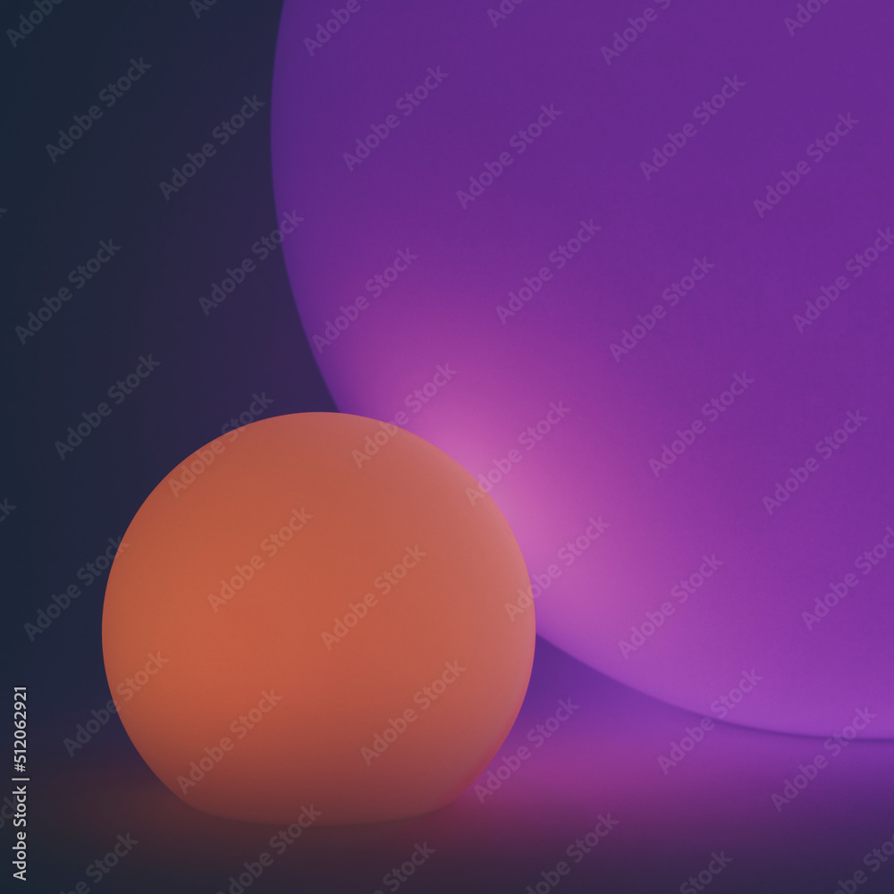 Glowing and illuminated spherical coloured orbs on a black background. Glowing and illuminated spherical coloured orbs on a black background.