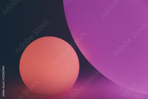 Glowing and illuminated spherical coloured orbs on a black background.
