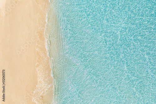 Relaxing aerial beach, summer vacation holiday template banner. Waves surf with amazing blue ocean lagoon, sea shore, coastline. Beautiful aerial drone top view. Tranquil bright beach, seaside nature © icemanphotos