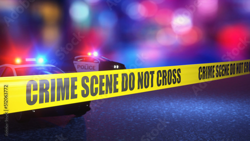 Fotografie, Obraz Crime scene with crime scene tape and blurred policed car in background
