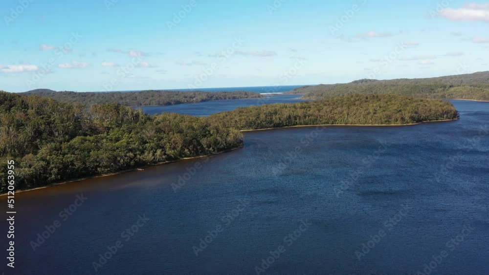 Aerial fast motion flying over Myall lake to Pacific ocean beach as 4k.
Aerial fast motion flying over Myall lake to Pacific ocean beach as 4k.