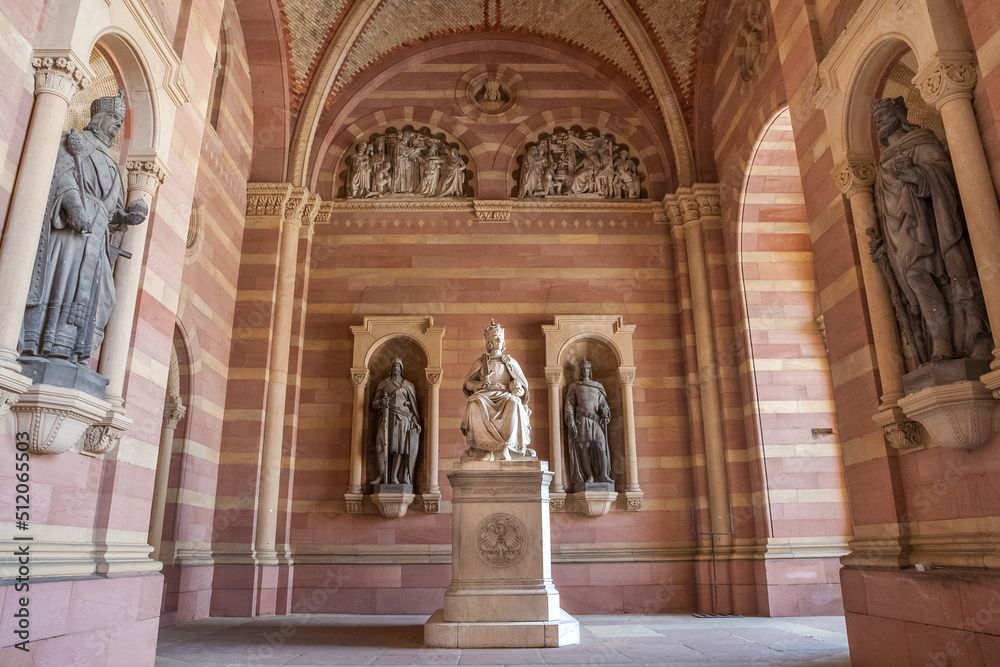 Lovely view of the statue of King Rudolf I of Habsburg in the narthex of the famous Speyer Cathedral in Rhineland-Palatinate, Germany. The monument shows the ruler sitting on a throne with his crown.