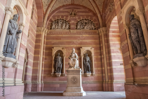 Lovely view of the statue of King Rudolf I of Habsburg in the narthex of the famous Speyer Cathedral in Rhineland-Palatinate, Germany. The monument shows the ruler sitting on a throne with his crown.