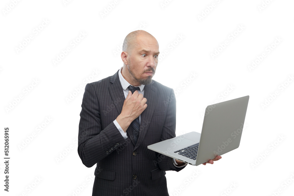 Bald man in suit looking very attentively at a laptop in his hands isolated on white background. Bald man in suit looking very attentively at a laptop in his hands isolated on white background.