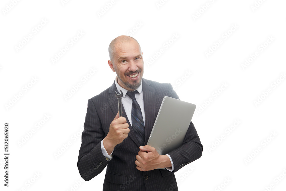 Caucasian man in suit holding adjustable wrench and looking at laptop in his hand for fixed isolated on white background. Caucasian man in suit holding adjustable wrench and looking at laptop in his hand for fixed isolated on white background.