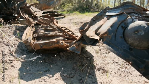 Destroyed tank metal scraps near Makariv. War in Ukraine concept.