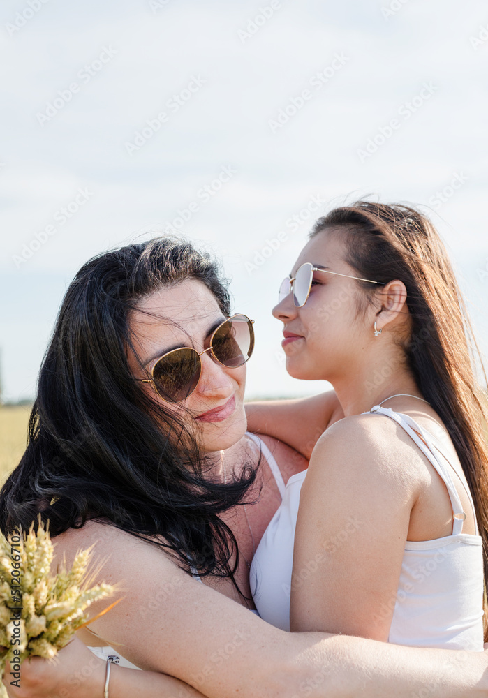 Two smiling female friends in the wheat field Two smiling female friends in the wheat field