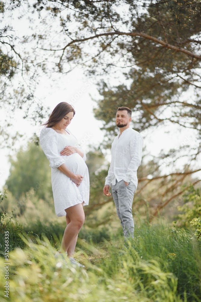 Pregnant woman with her family looking happy