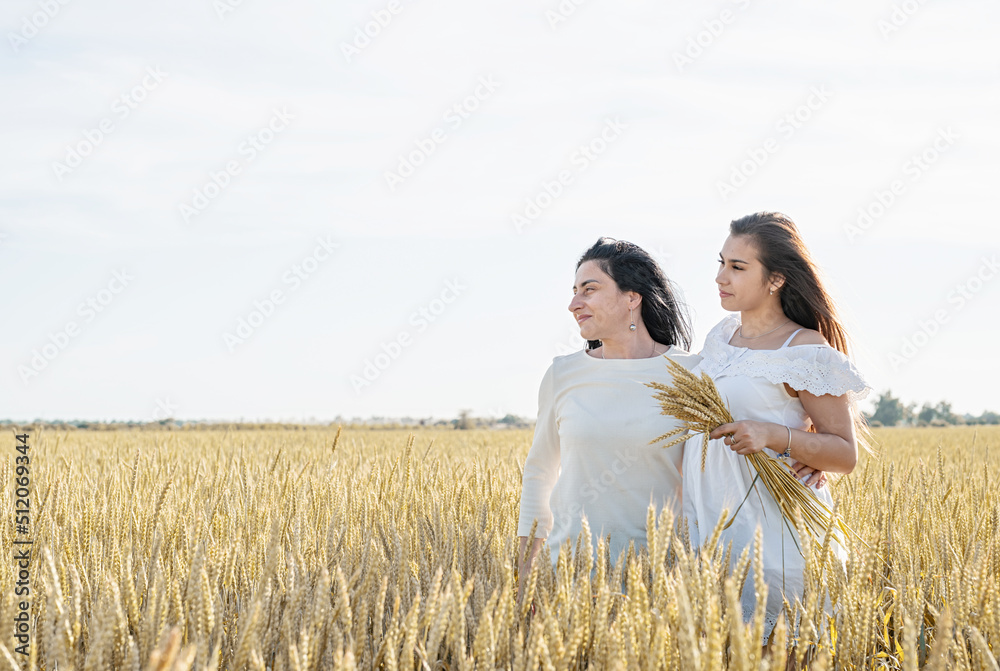 Two smiling female friends in the wheat field Two smiling female friends in the wheat field