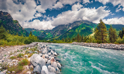 Azure river in Caucasus mountains. Spectacular summer scene of Upper Svaneti, Georgia, Europe.Beauty of nature concept background..