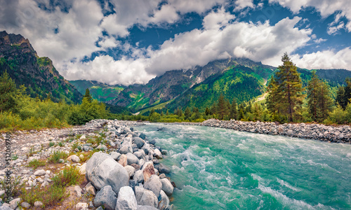 Azure river in Caucasus mountains. Spectacular summer scene of Upper Svaneti, Georgia, Europe.Beauty of nature concept background.. photo