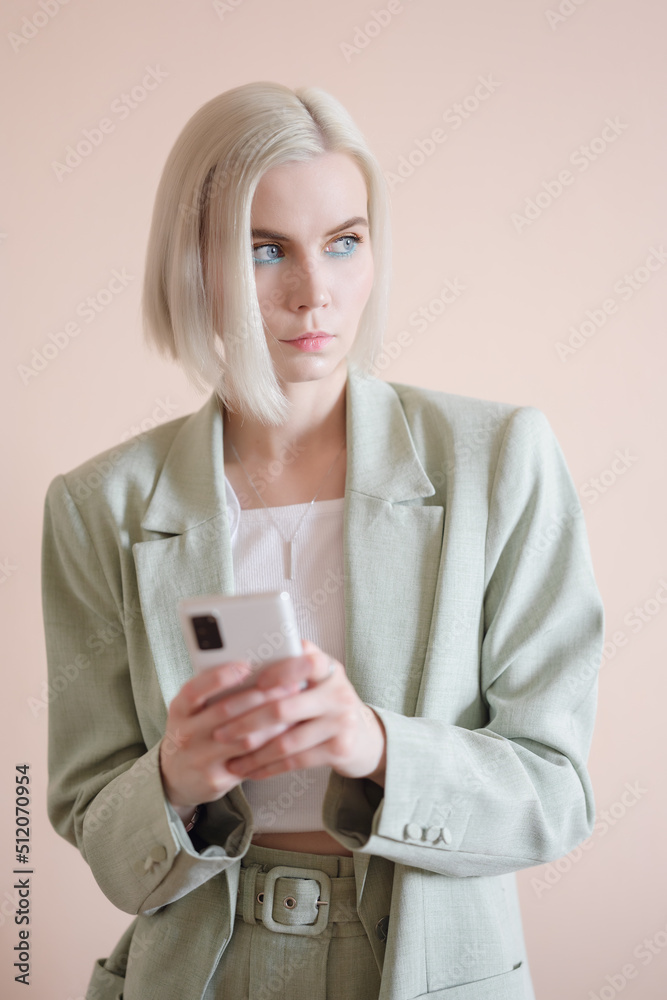 Young pensive woman with smartphone. Young pensive woman with smartphone.