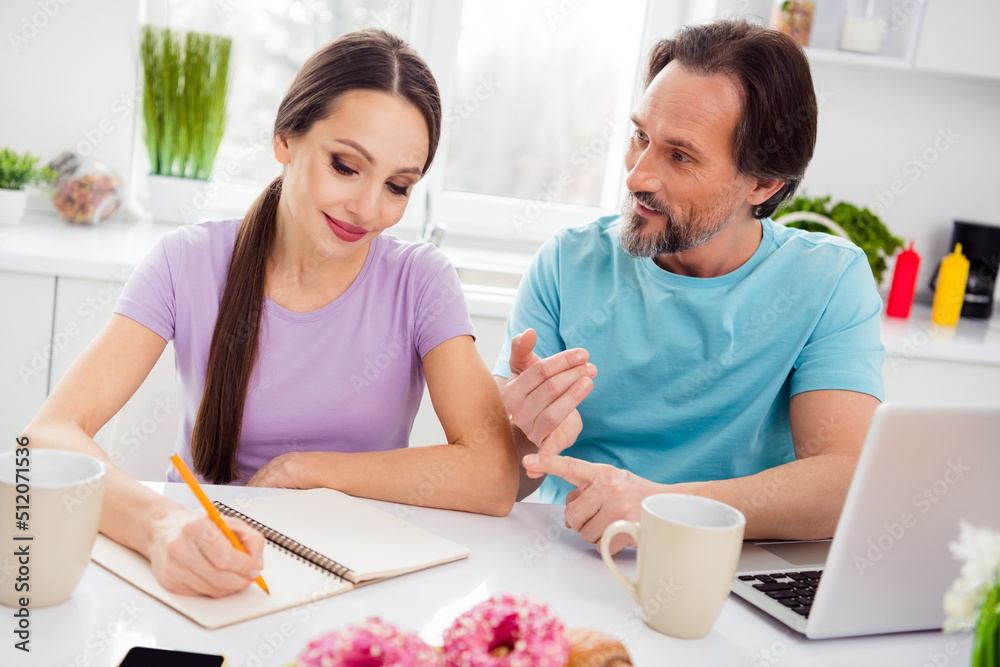 Photo of good mood mature wife husband dressed casual outfits thinking new cooking recipes lunch modern devices indoors home room Photo of good mood mature wife husband dressed casual outfits thinking new cooking recipes lunch modern devices indoors home room