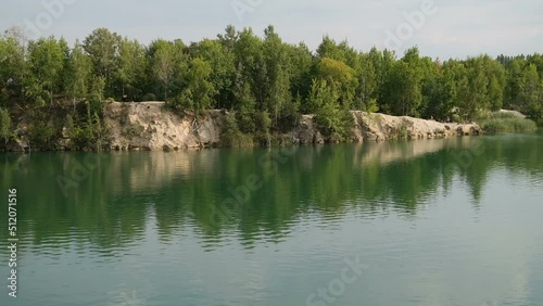 Serenity landscape during dusk, water reflects scenery of sky in a calm, tranquil and peaceful scene.