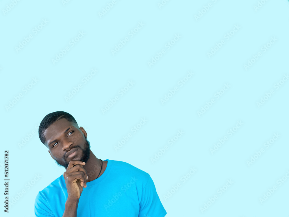 Pensive man. Offer decision. Advertising background. Interested guy with curious expression thinking of choice isolated on blue copy space. Pensive man. Offer decision. Advertising background. Interested guy with curious expression thinking of choice isolated on blue copy space.