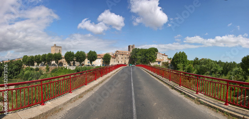 Fototapeta Naklejka Na Ścianę i Meble -  Skyline of the old town of Fabrezan with a road bridge over Orbieu river in Aude, Occitanie region in France