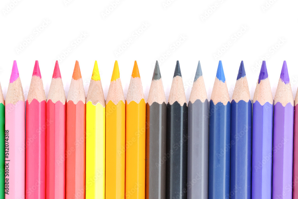 Lots of colored pencils lined upisolated on white background. Lots of colored pencils lined upisolated on white background.