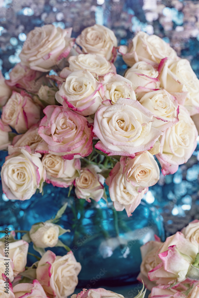 Close-up floral composition with a pink roses .Many beautiful fresh pink roses on a table.

