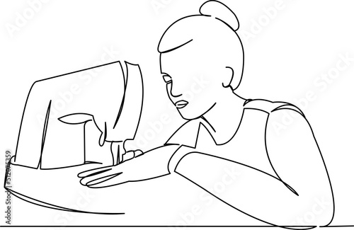 girl sews on a sewing machine