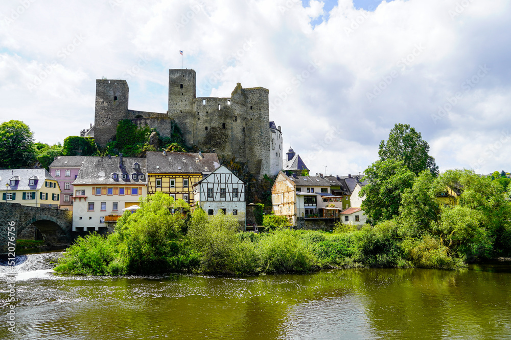 Runkel Castle in Runkel. Old castle on the Lahn with an old stone bridge. Landscape by the river with historic buildings.
