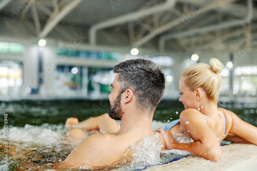 Couple in the pool with thermal water.