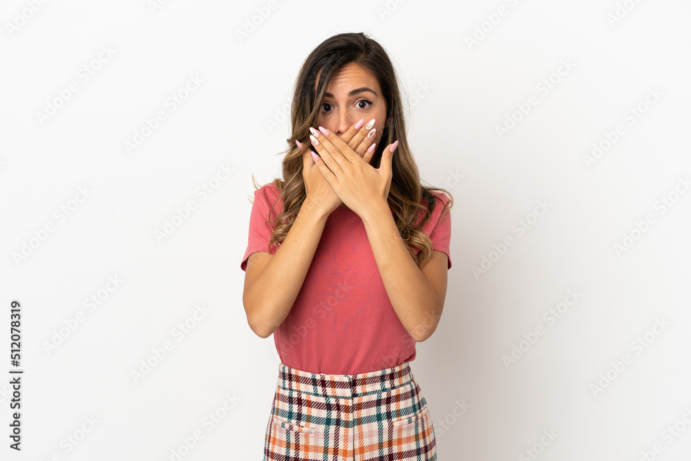 Young woman over isolated background covering mouth with hands Young woman over isolated background covering mouth with hands