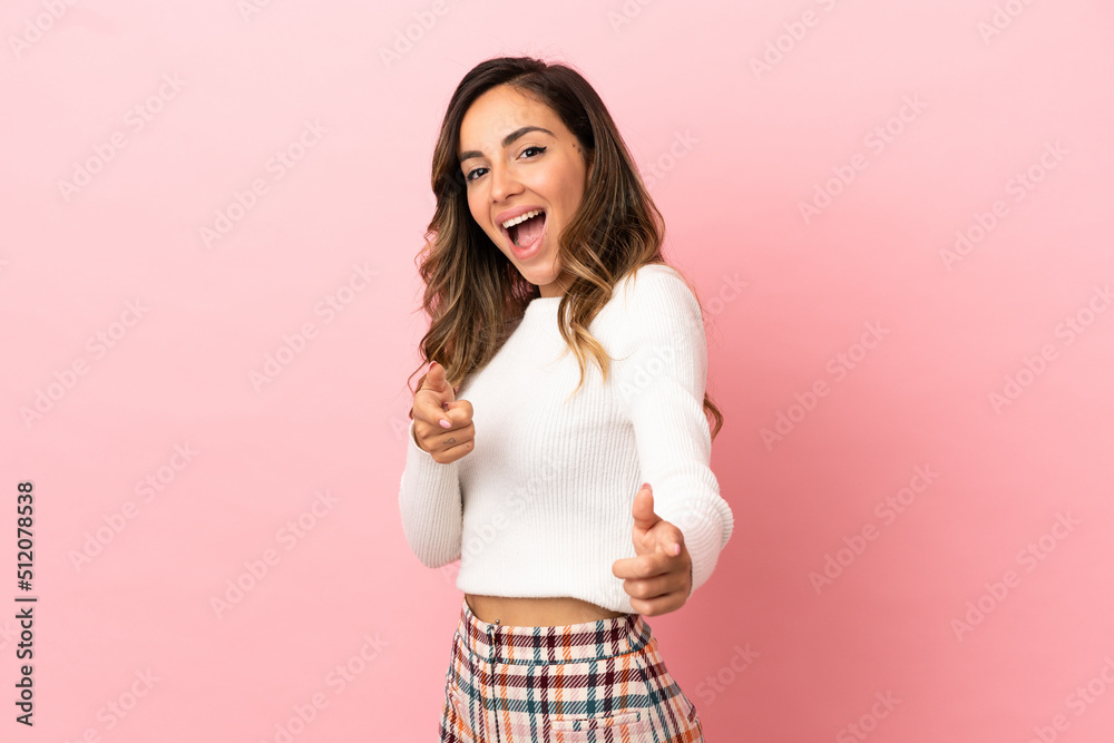 Young woman over isolated background pointing to the front and smiling Young woman over isolated background pointing to the front and smiling