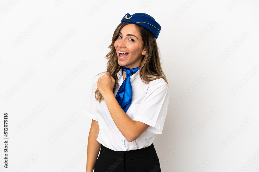 Airplane stewardess over isolated white background celebrating a victory Airplane stewardess over isolated white background celebrating a victory