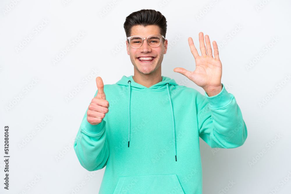 Young handsome caucasian man isolated on white bakcground counting six with fingers Young handsome caucasian man isolated on white bakcground counting six with fingers