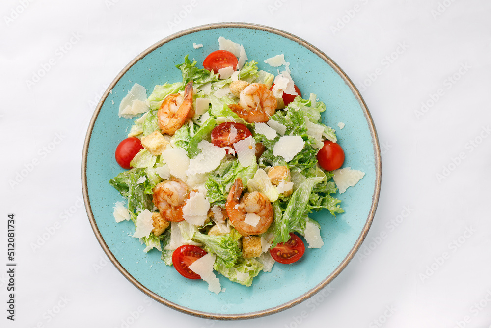 Grilled shrimp and salmon salad on a white background Grilled shrimp and salmon salad on a white background