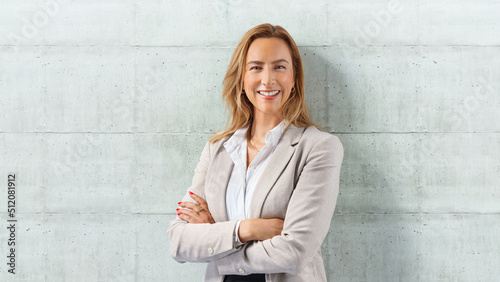  business woman lean on wall with copyspace at right side