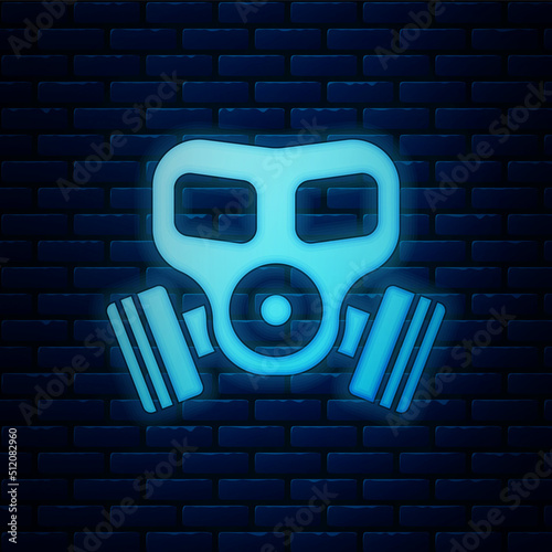Glowing neon Gas mask icon isolated on brick wall background. Respirator sign. Vector
