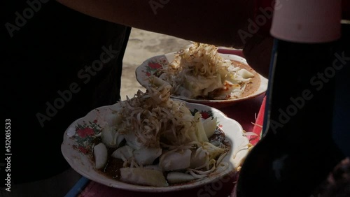 close up Grinding peanut sauce for Indonesian traditional food, Ketoprak, manually called ulekan photo