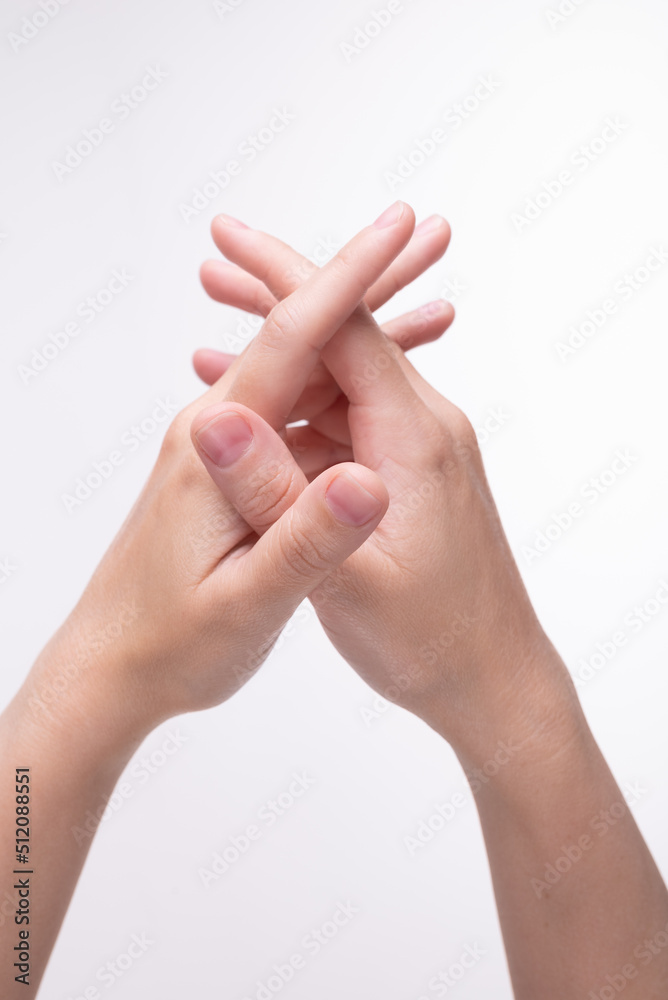 Woman's hands with crossed fingers
Woman's hands with crossed fingers