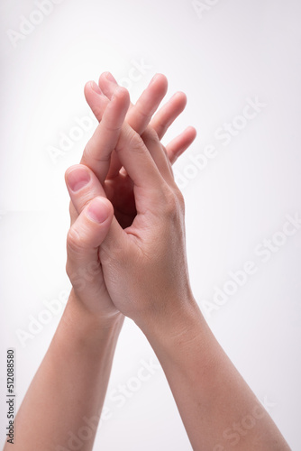 Woman's hands with crossed fingers