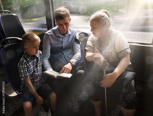 Young guy evangelizing in the bus photo