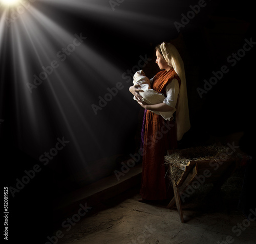 Fotografia Mary in the stable near the manger with the baby